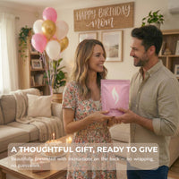 Man and woman holding a pink gift pearled candle bag with text 'Happy Birthday Mom' and product details.