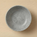 Gray textured bowl on a beige background