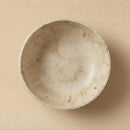 Coconut shell bowl on a beige background